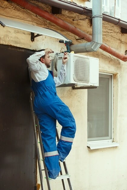 Hvac Technician Working on Hvac System